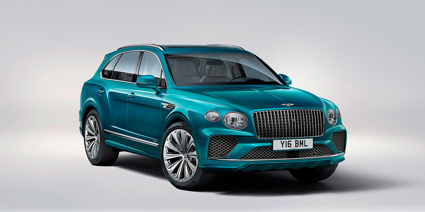 Bentley Hyderabad Bentley Bentayga Azure front three-quarter view, featuring a fluted chrome grille with a matrix lower grille and chrome accents in Topaz blue paint.
