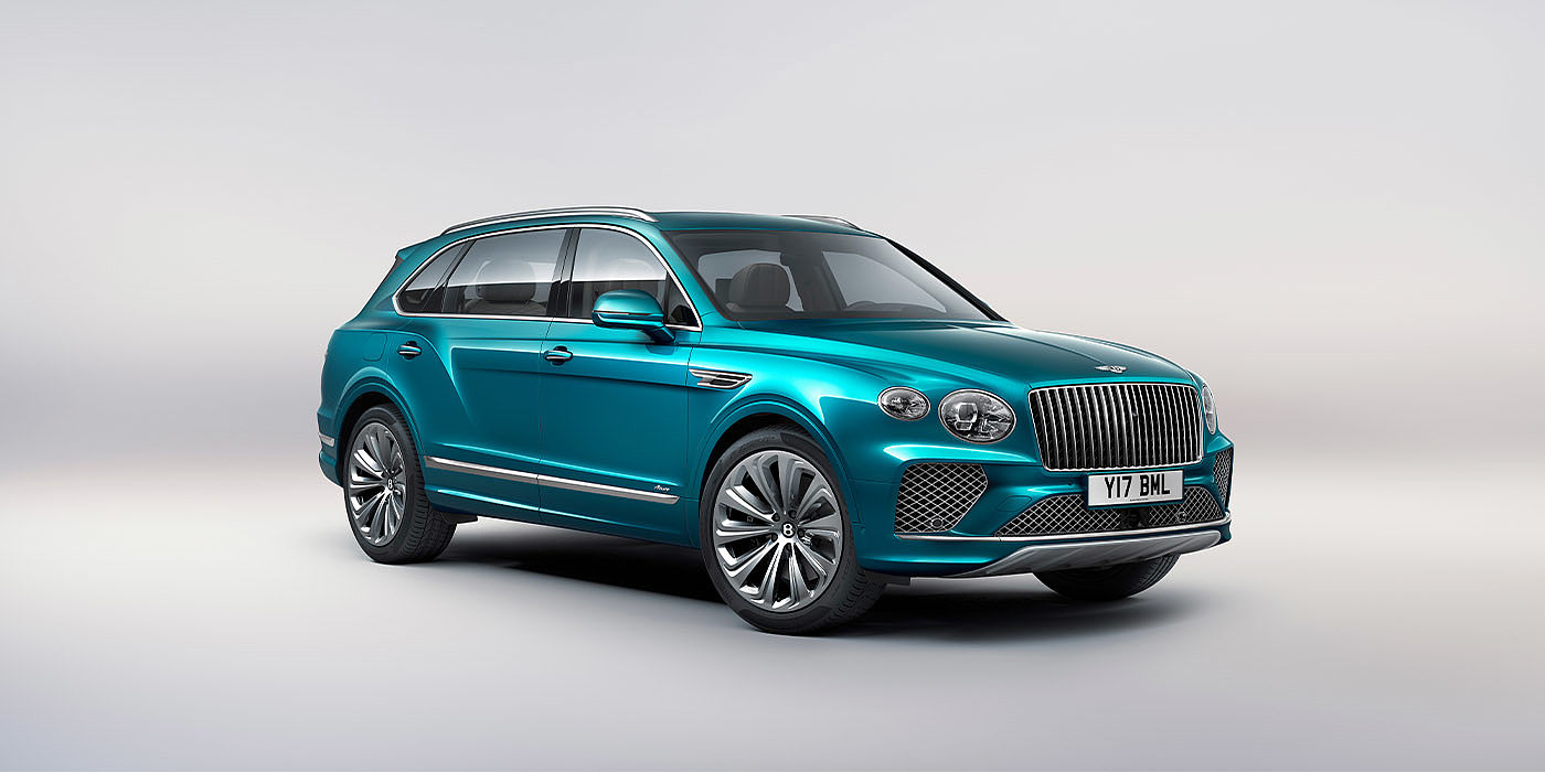 Bentley Hyderabad Bentley Bentayga EWB Azure front three-quarter view, featuring a fluted chrome grille with a matrix lower grille and chrome accents in Topaz blue paint.