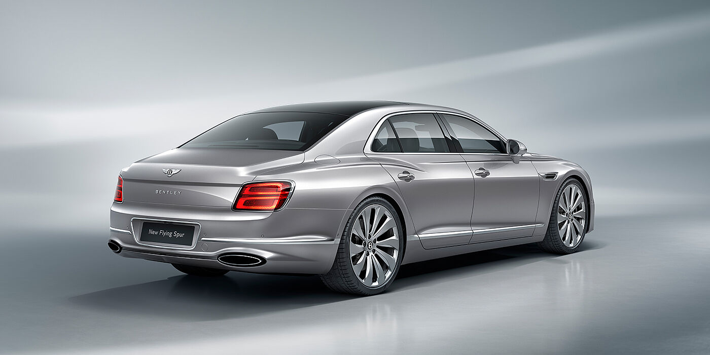 Bentley Hyderabad New Bentley Flying Spur sedan rear view in Silverlake paint with ten spoke wheels and chrome matrix grille