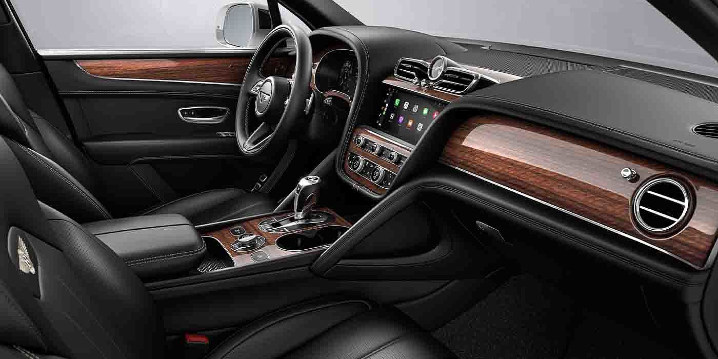 Bentley Hyderabad Bentley Bentayga EWB interior with a Crown Cut Walnut veneer, view from the passenger seat over looking the driver's seat.